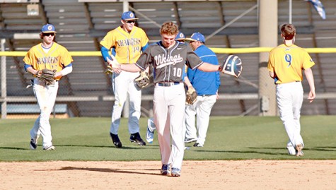 Warren Central’s Brooks Boolos (10) shrugs his shoulders as Oxford’s players celebrate behind him Friday. Boolos was robbed of the game-tying hit by Oxford right fielder Houston Roth for the game’s final out, and Oxford escaped with a 3-2 victory. (Ernest Bowker/The Vicksburg Post)