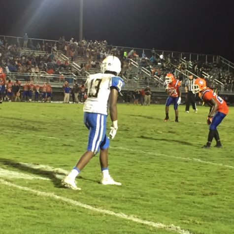 Junior wide receiver Barry Flowers lines up out wide before the snap.