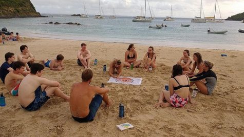 Students listing morals and expectations on a flag they flew during the whole trip. Each member still has a strip of the flag tied on their ankle, not one kid has removed it since the trip. 