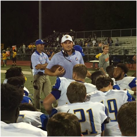 Head coach Chris Cutcliffe talks to his team after the game.