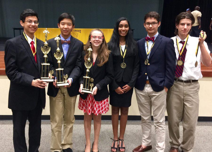 (from left to right) Sophomore Marawan Elghory, freshman Edward Hu, sophomore Edith Marie Green, junior Akshaya Vijaysankar, senior Dylan Howard, and freshman Toby ODonnell pose with their awards at the first debate tournament of the school year.