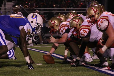 The Charger offensive line lines up across from Lafayette's offensive line.