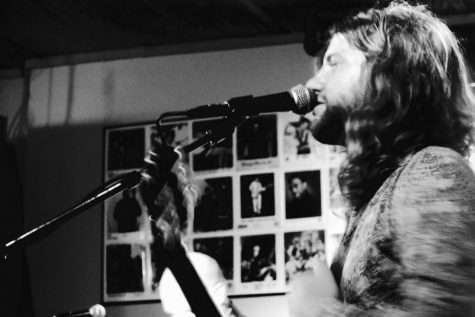 Caleb Hutson of Tesheva welcomes the crowd on Friday night at Proud Larry's. 