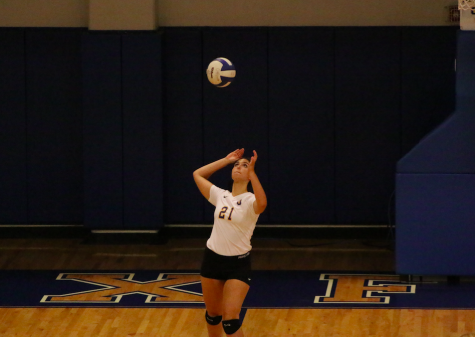 Senior Haley Caradine serves the ball against Corinth.