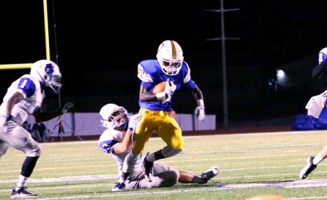 Junior wide receiver Damarea Burt breaks a tackle from a Saltillo defender.