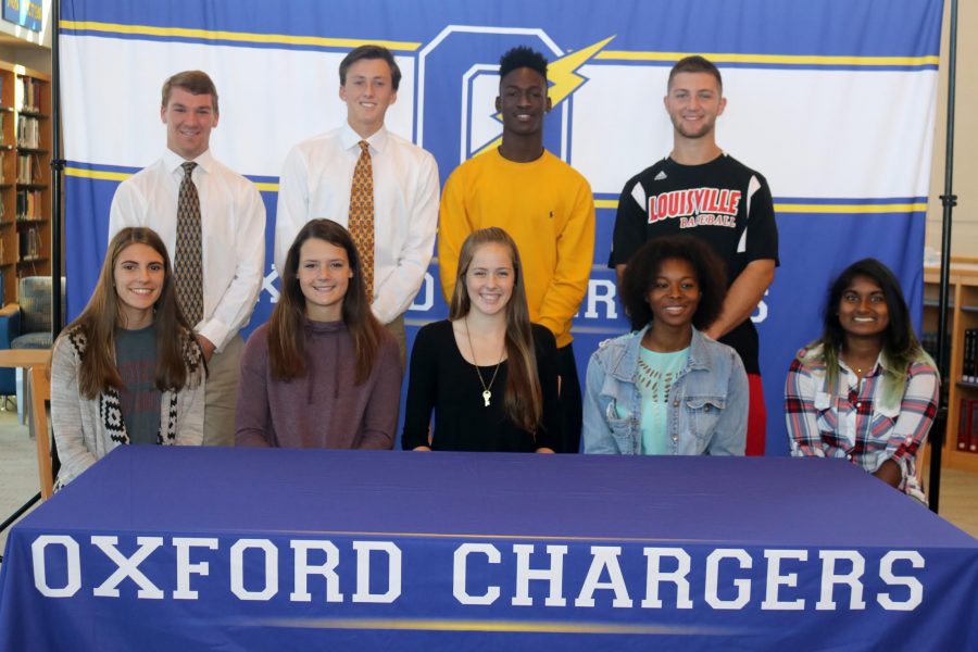 Nine student-athletes signed their National Letter of Intent in the OHS Library on Wednesday, November 9.