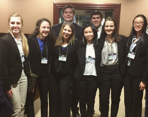 Left to right: junior Ann Sullivan, senior Rebecca Grayzel-Ward, senior Reed Cooper, senior Mary Lauren Green, sophomore Anneke Buskes, junior Josh Pearson, senior Virginia Parkinson, and junior Joanna Bu gather for a picture after competing at the Mock Trial regional competition on Jan. 28, where they went undefeated.