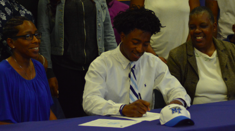 OHS football players sign National Letter of Intent