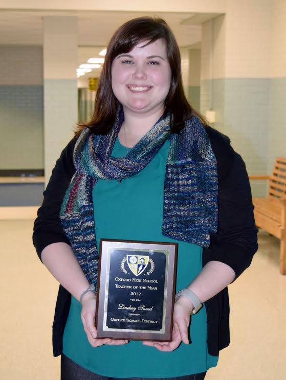 Algebra teacher Lindsey Sneed receives OHS Teacher of the Year award.
