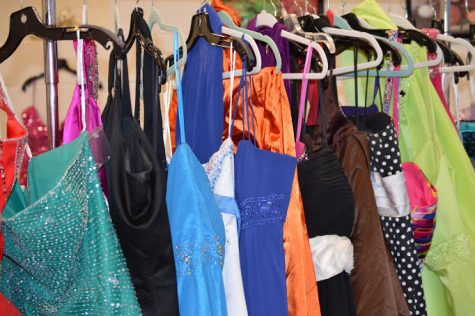 Dresses donated by members of the Oxford community hang at the