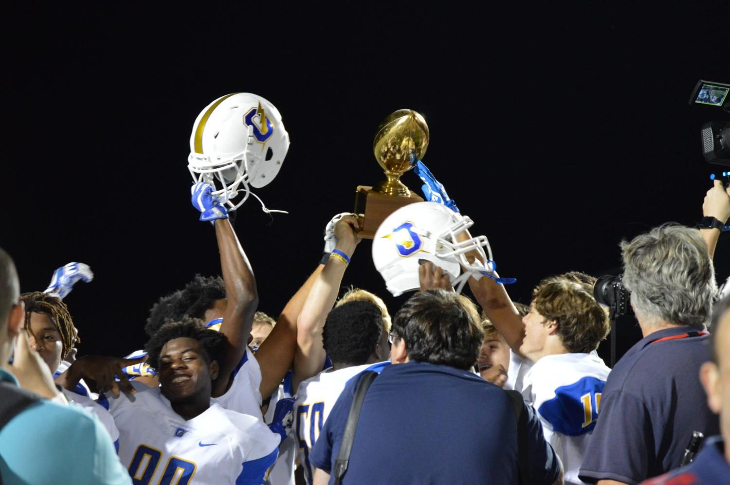 The Chargers hoist the Crosstown Classic Trophy following the Oxfords 41-17 win over Lafayette.