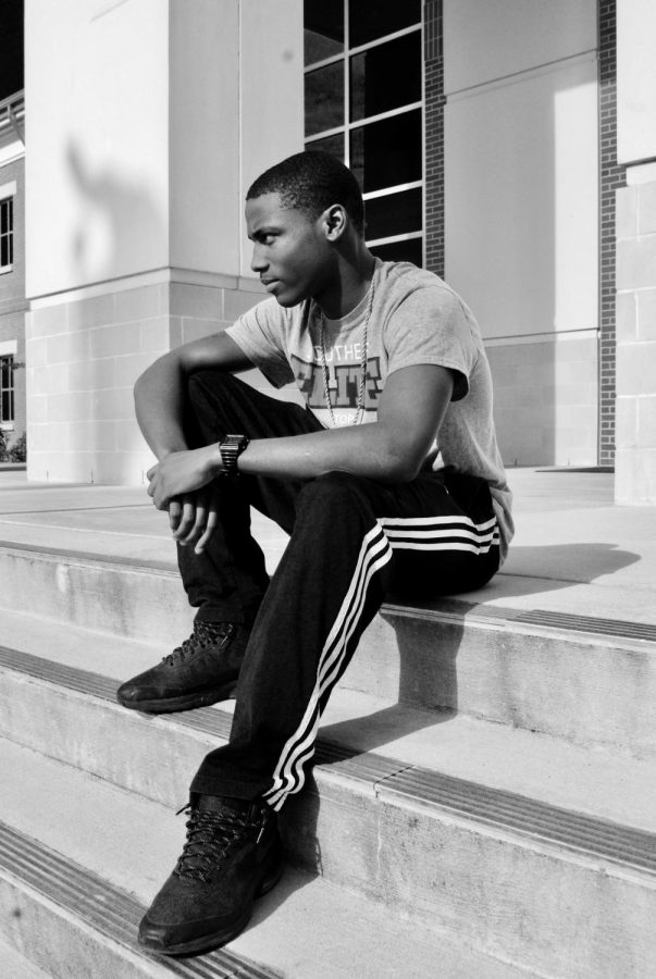 Senior Marquise Chicago Hubbard sits on the front steps of Oxford High School.