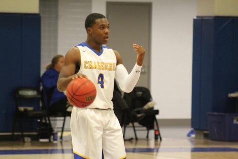 Boys basketball team remains undefeated, gains last minute win against Ashland