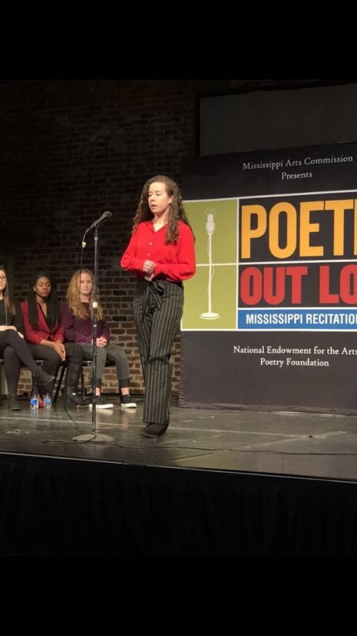 Junior Anna Claire Franklin recites her poem in the Regional Poetry Out Loud contest. She won first in the competition and will compete in the state competition March 6.