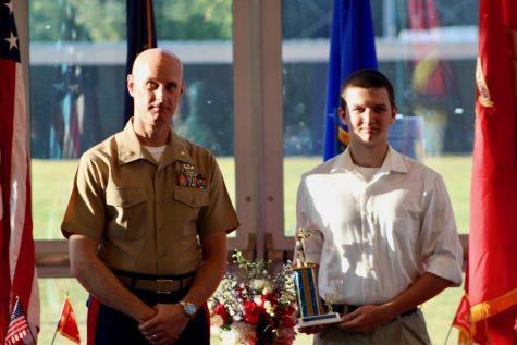 Senior Darryl Fogerty receives an award from Major General Brent Hampton at the JROTC awards banquet. This event is held annually to commemorate the achievements of those in the OHS JROTC program.