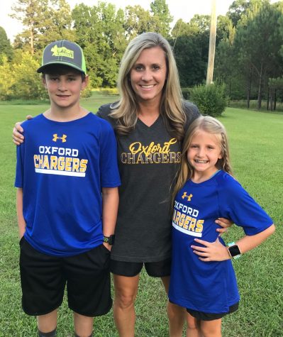 Amanda Gulledge poses with her kids, Fisher and Emory. Gulledge is new to the school district this year, and she and her children commute from Bruce, Mississippi each morning. 