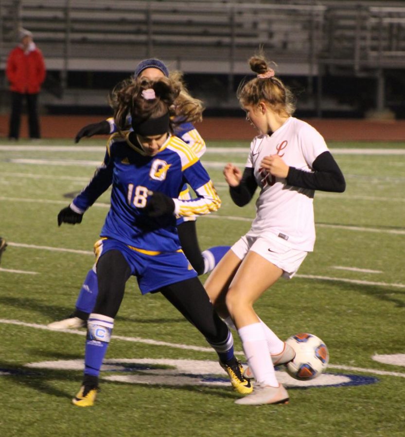 Senior Addie Thompson defends the ball against a Lafayette Commodores player earlier this season. The Chargers game against Clinton was also senior night for the girls team, where seven seniors were honored.