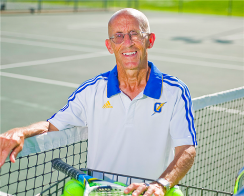 Tennis coach Louis Nash smiles on the tennis court. Nash has been coaching at Oxford nineteen years.