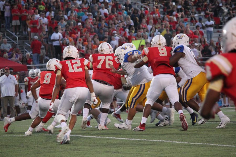 The Oxford offensive line battles against the Lafayette Commodore defensive line earlier in the season against Lafayette. Oxford won the game 46-7.