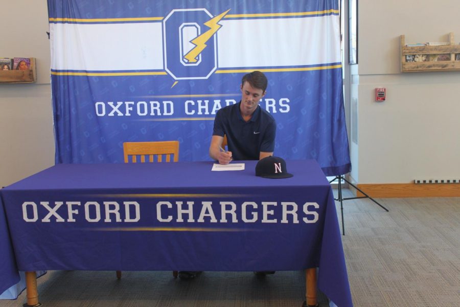 Senior Owen Bruce signs his commit to Northwest Community College. Bruce is a member of the OHS Baseball team.