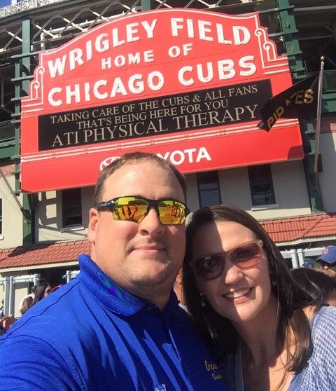 History teacher Daniel Parrish and his wife Lana Parrish smile in front of Wrigley Field. Daniel Parrish teaches history and coaches baseball for OHS.