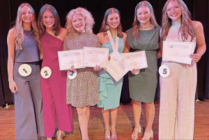 Juniors Cate Callicutt, Sarah Ross Latimer, Evelyne Denham, Ava Randle, Kate Riddle, and Mary Cile Meagher pose for a picture at the Lafayette County Distinguished Young Women competition.