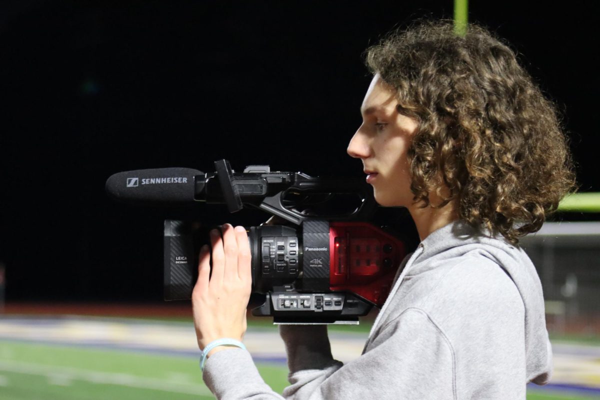 Sophomore Anderson Shows shoots film
on the sidelines of different sporting events. Shows can be found with a camera in his hand at most OHS events.