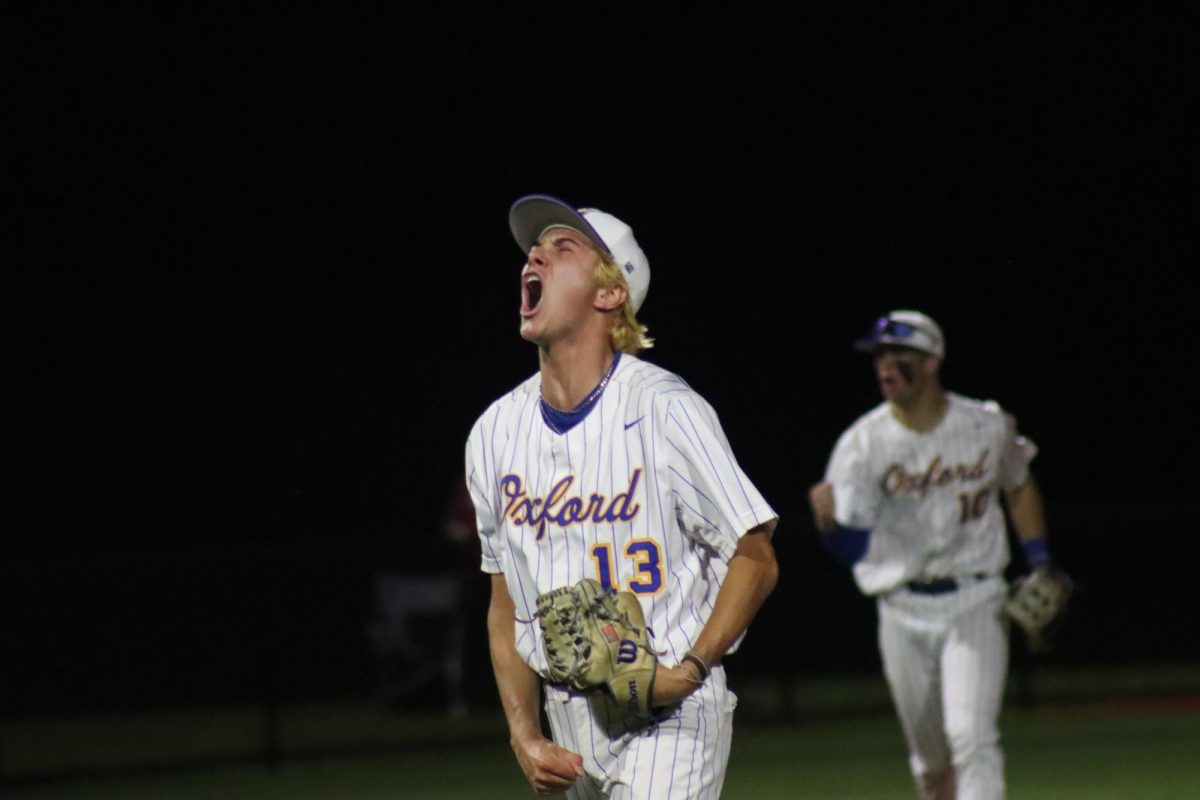 Freshman Hayes Huggins celebrates as he comes off the field after a strikeout in game three of round one.