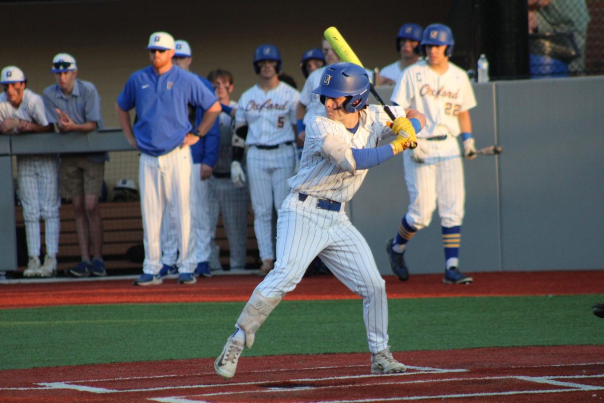 Senior Sam Roy prepares his swing at the ball in the Chargers game against Madison Central in the playoffs.