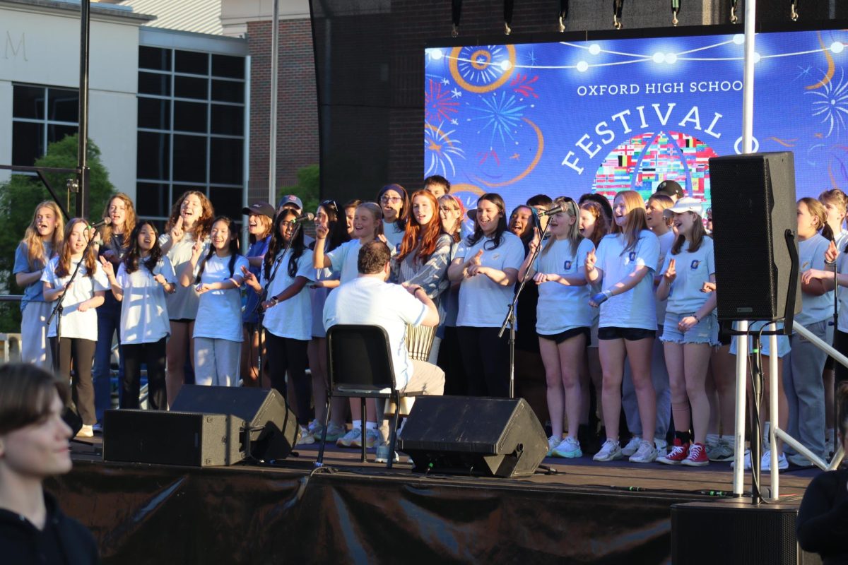 OHS’s Choir performs on stage at the Festival of Nation. The choir sang songs from all different cultures and in multiple languages.
