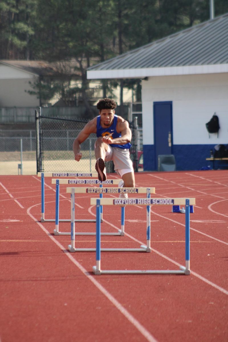 Junior Kamar Houston prepares for the hurdles event at the Oxford Invitational meet. Houston has been a member of the team for three years.